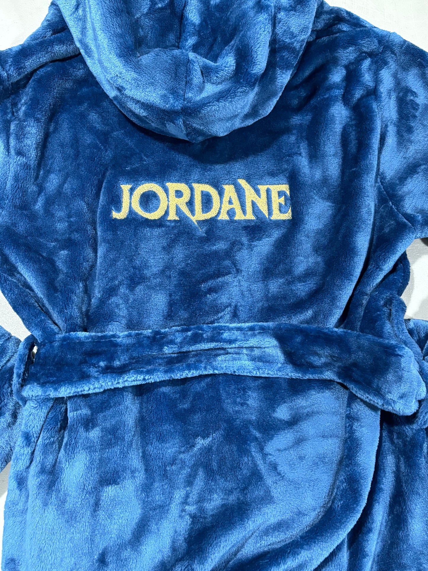 Plush fleece navy blue bathrobe with hood and custom embroidery name on back.