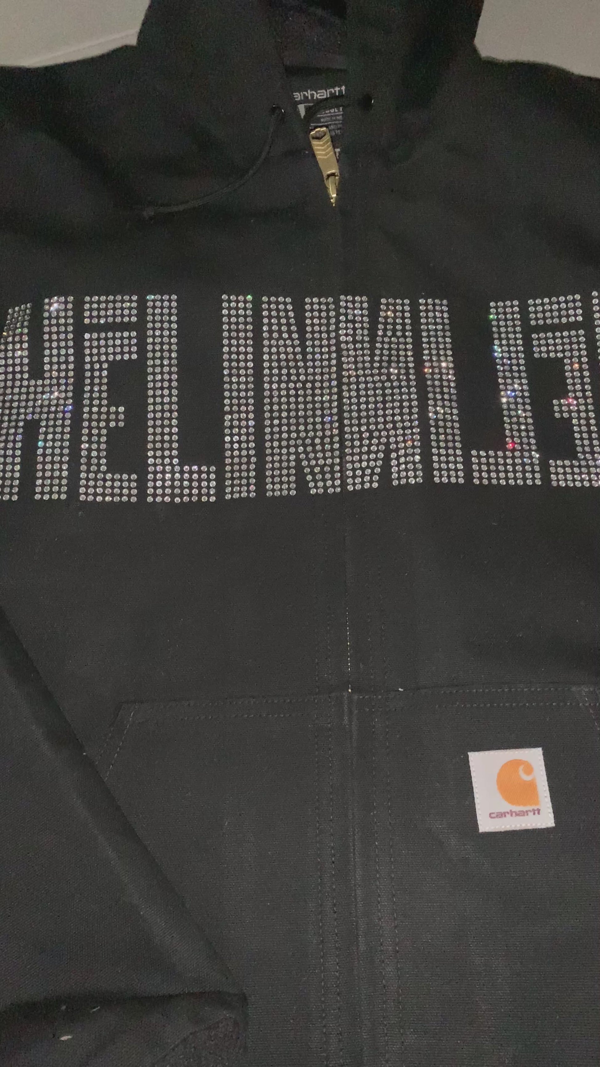 Video of custom rhinestones design with clear crystals on men's Carhartt  jacket