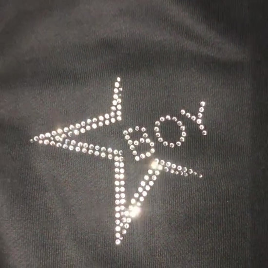 Video of custom rhinestones design  on black sweatsuit 